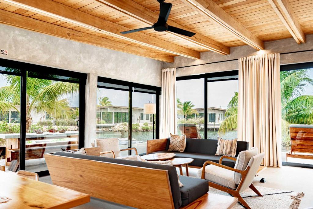 a living room with a couch and a table at Seabird Villa 3 in Placencia