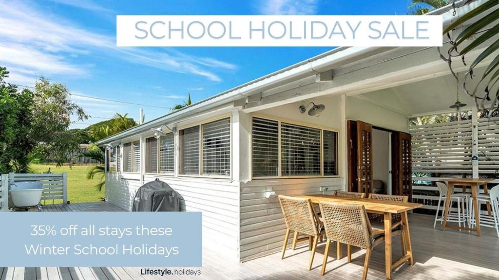 a school holiday sale of a white school holiday house at Tullenderly in Wooli