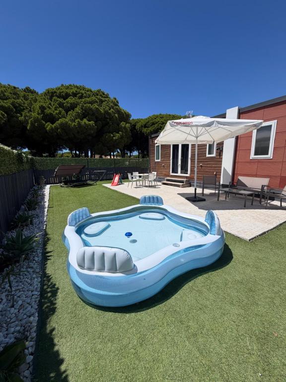 a large inflatable pool in the yard of a house at Mobil Home La Barrosa in Chiclana de la Frontera