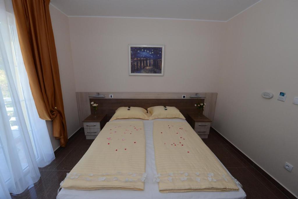 Postel nebo postele na pokoji v ubytování Vila Milo