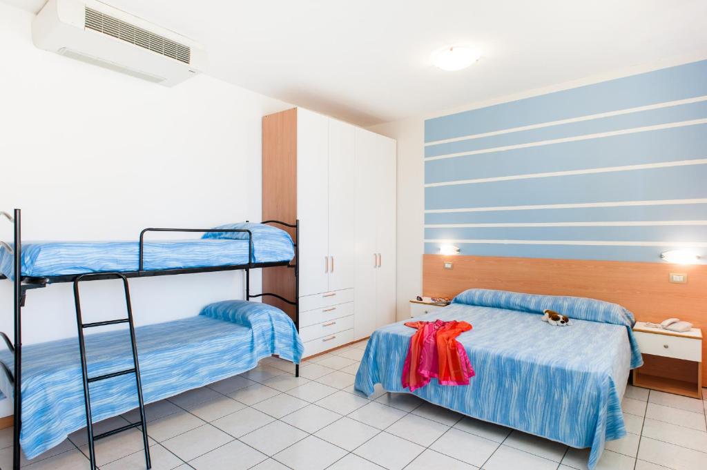 A bed or beds in a room at Welcome Residence per famiglie