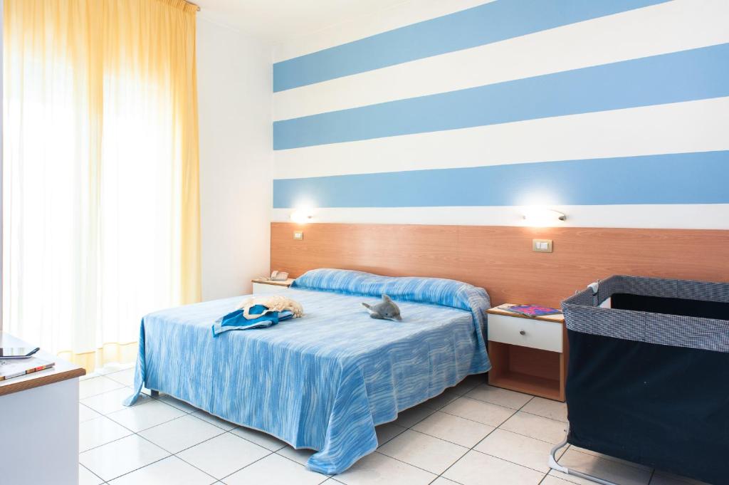 A bed or beds in a room at Welcome Residence per famiglie
