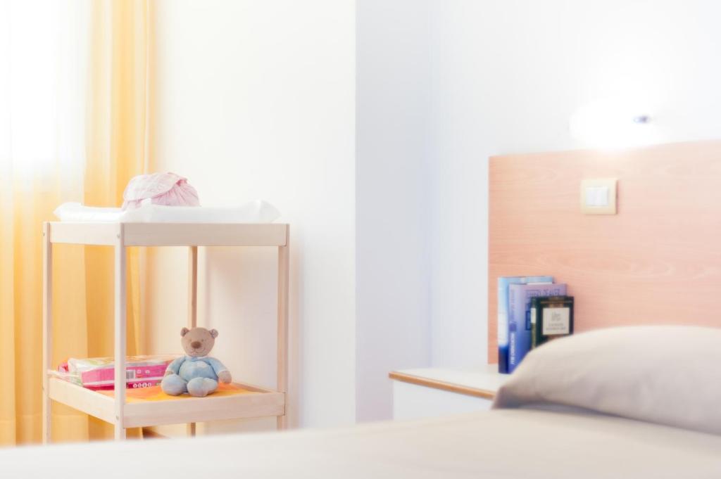 A bed or beds in a room at Welcome Residence per famiglie