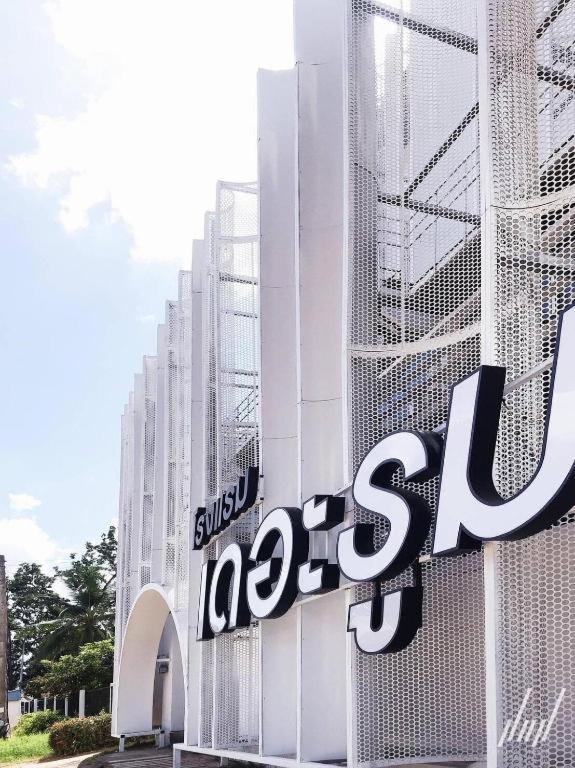 a large sign on the side of a building at The Room Hotel in Ban Nong Puk