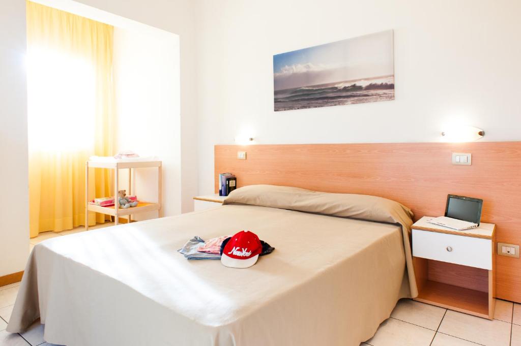 A bed or beds in a room at Welcome Residence per famiglie