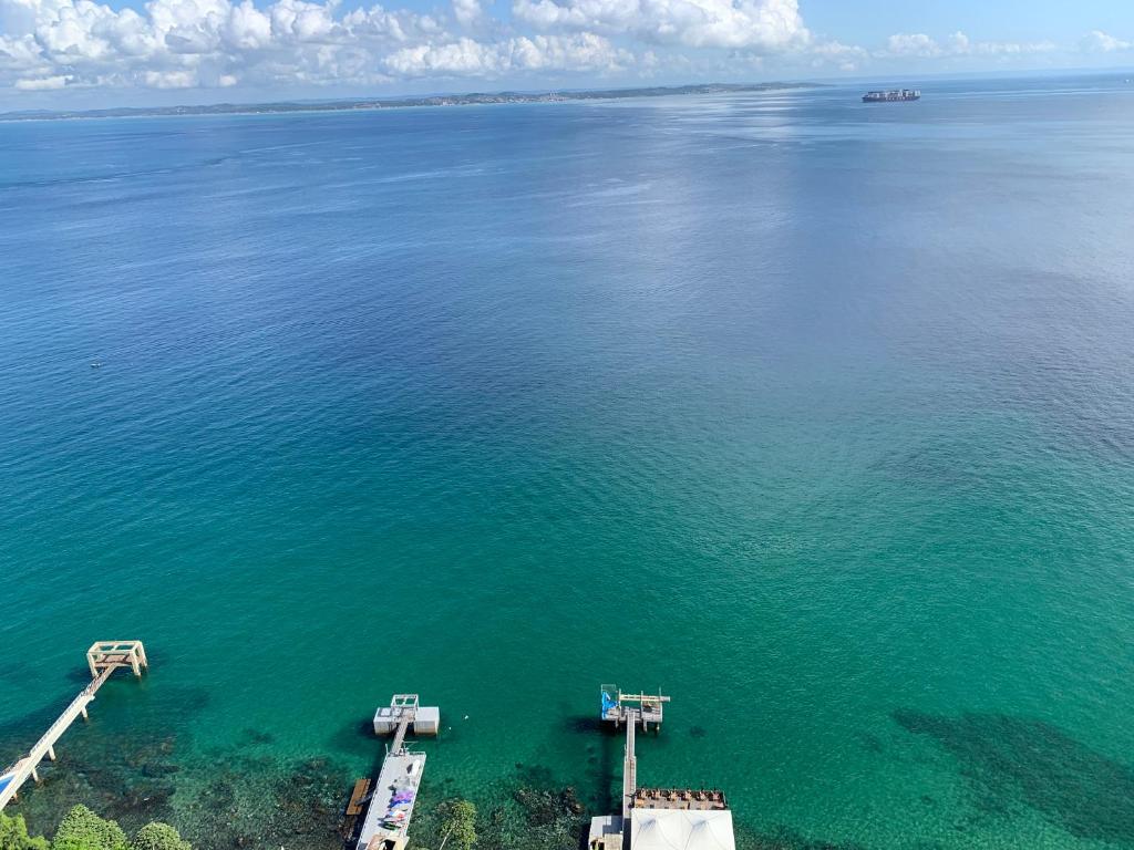 an aerial view of a large body of water at Vitória Marina Flat in Salvador