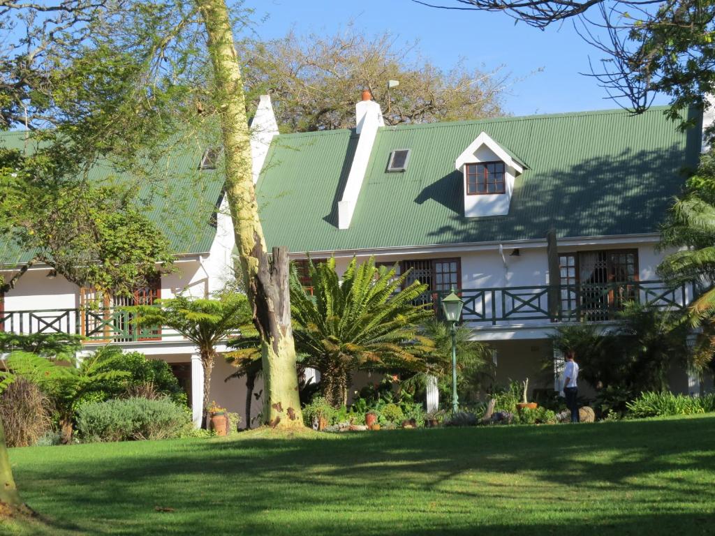 a house with a green roof at Cuckoos Nest Guest House in Louis Trichardt