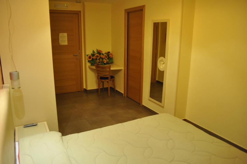 Postel nebo postele na pokoji v ubytování Aerhotel Phelipe