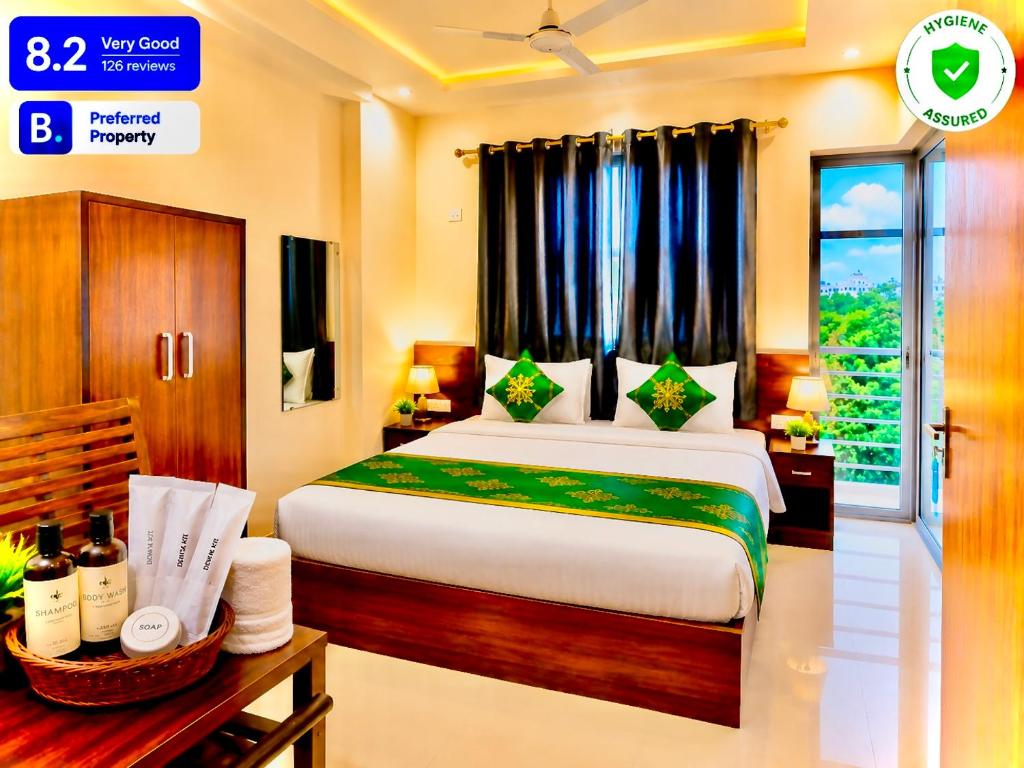 a hotel room with a bed and a window at Hotel Pleasant Taj Agra -Budget Family AC Rooms in Tājganj
