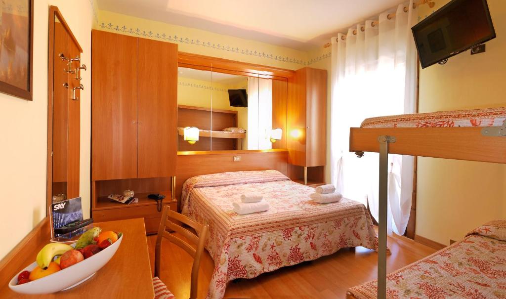 Postel nebo postele na pokoji v ubytování Hotel Germania