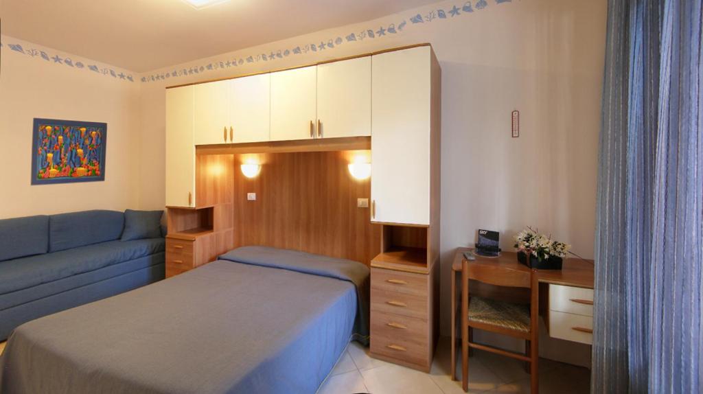Postel nebo postele na pokoji v ubytování Hotel Germania