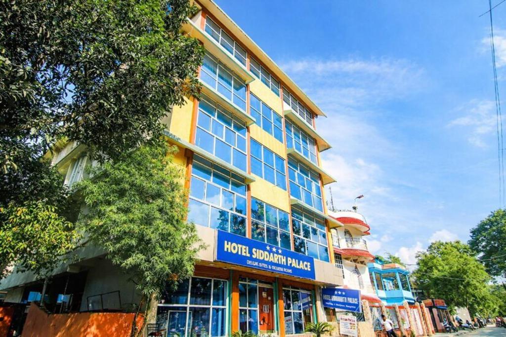 a building with a sign on the side of it at Hotel Siddarth Palace in Mangaldai