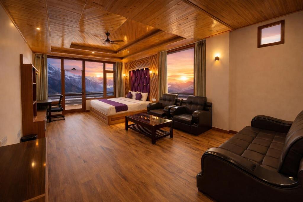 a large living room with a couch and a table at The Manali Suites & Villas, Manali - Luxury Stay Away From City Hustle in Manāli