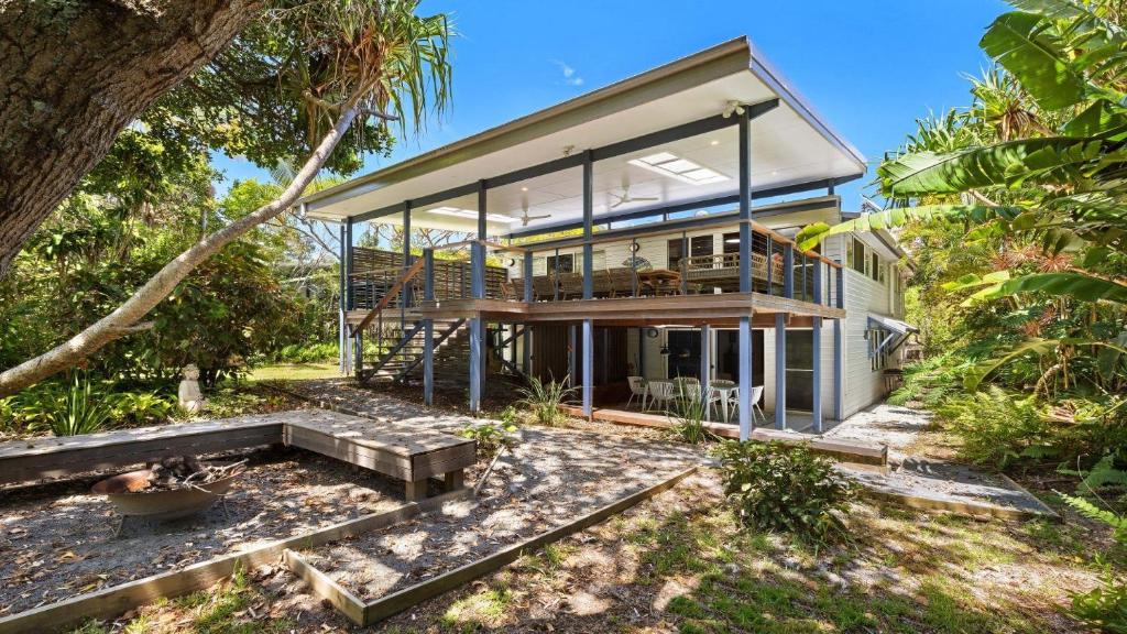 a large house with glass doors and a balcony at Salty Seaside in New Brighton