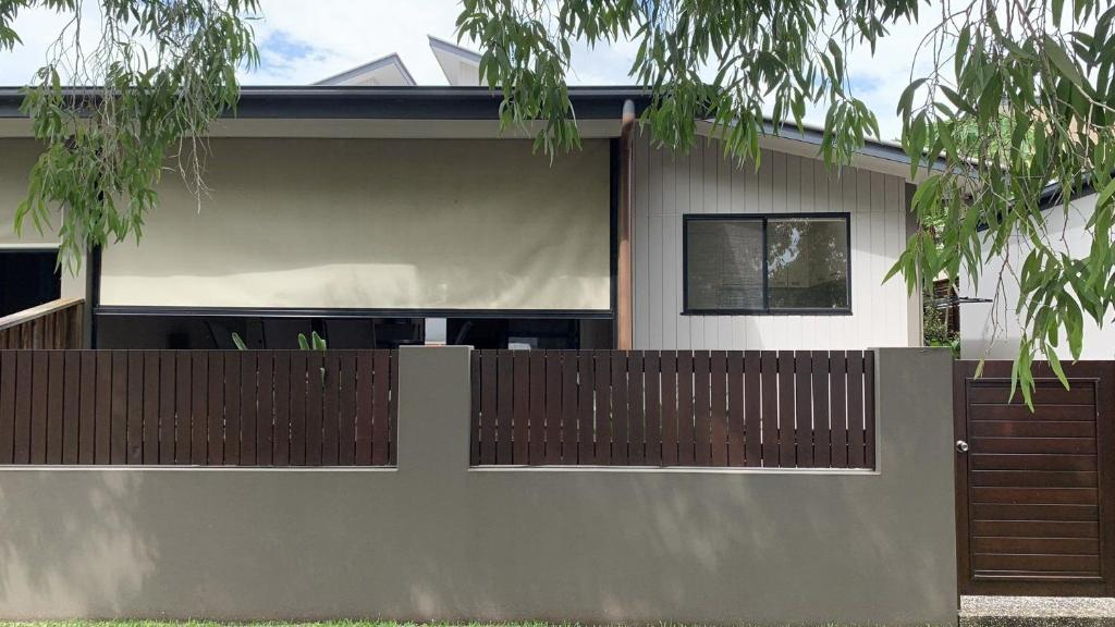 a fence in front of a house at Hook Wine & Sinker in Brunswick Heads