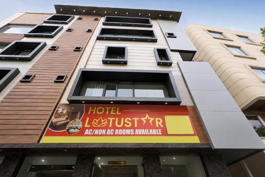 a building with a sign on the side of it at FabHotel Lotus Star in New Delhi