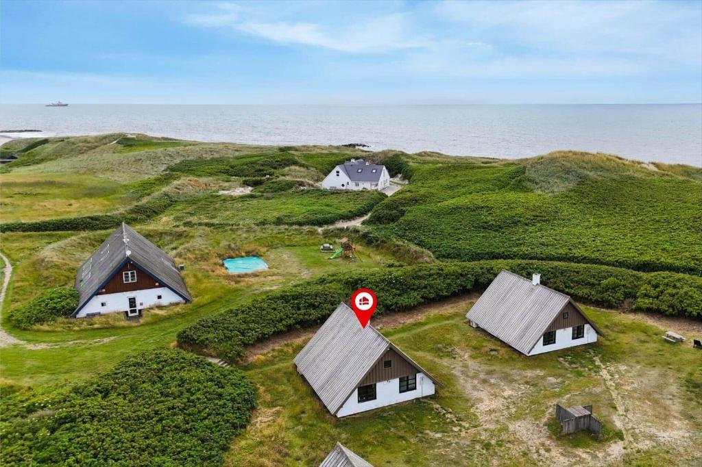 a group of houses on a small island in the ocean at 530-Lemvig-Lokkevej-59-D in Lemvig