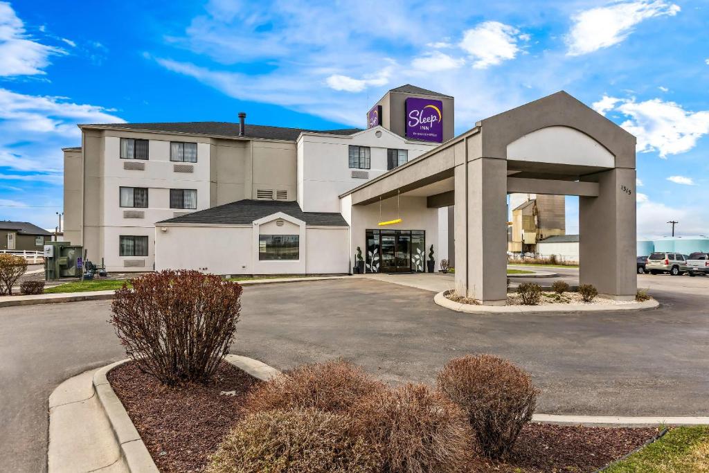 a hotel with a sign on top of a building at Sleep Inn Nampa near Idaho Center in Nampa