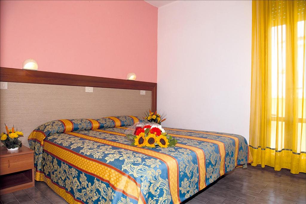 Postel nebo postele na pokoji v ubytování Hotel Bettina