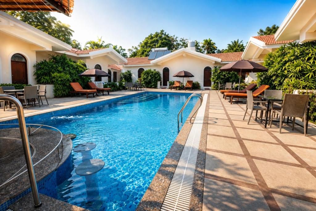 an image of a swimming pool in a house at Jacks Resort in Vagator