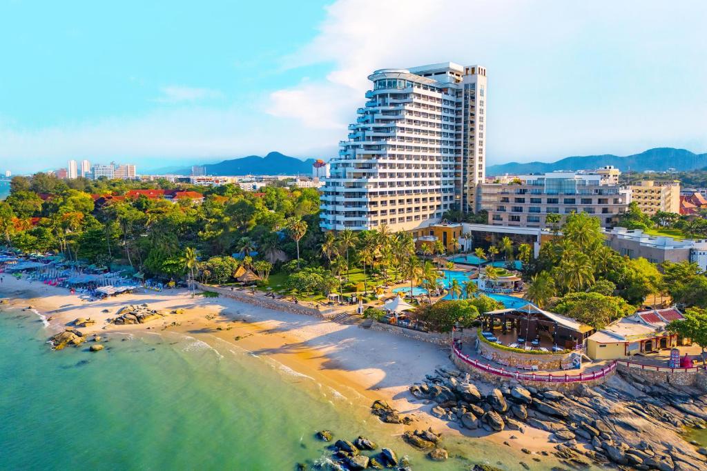an aerial view of a beach with a tall building at Hilton Hua Hin Resort & Spa in Hua Hin