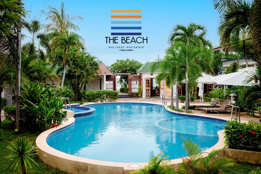 a view of a swimming pool at the beach resort at The Beach Wellness Residence in Ban Pru Yai