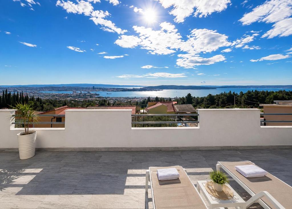 a view from the balcony of a house at Beautiful duplex apartment with view in Kaštela