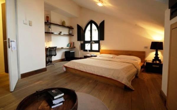 Postel nebo postele na pokoji v ubytování Nine Hotel