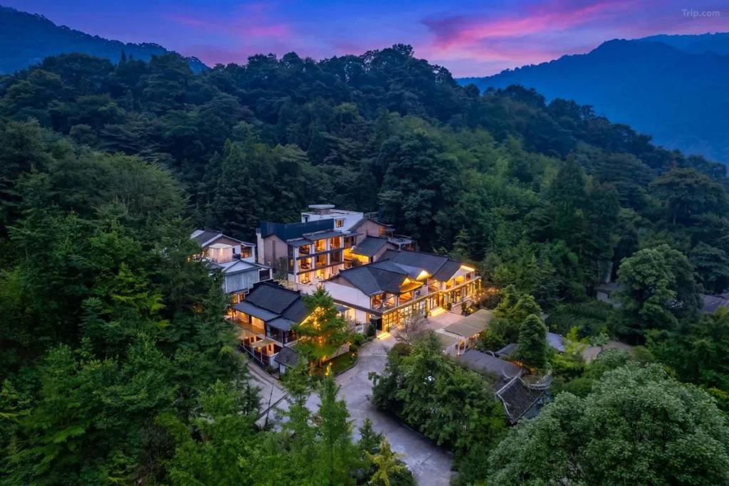 an aerial view of a house in the mountains at Jade Peak Hot Spring Villa in Dujiangyan