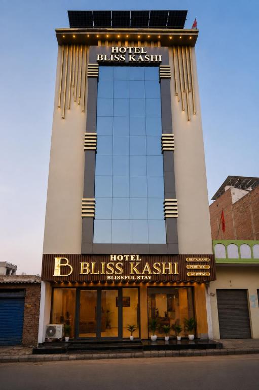 a building with a sign on the front of it at Hotel Bliss Kashi in Kakarmatha