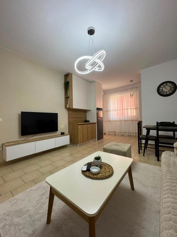 a living room with a couch and a table at Lushnja Central Elegance in Lushnjë