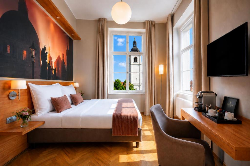 a hotel room with a bed and a window at Hotel Adler - Czech Leading Hotels in Prague
