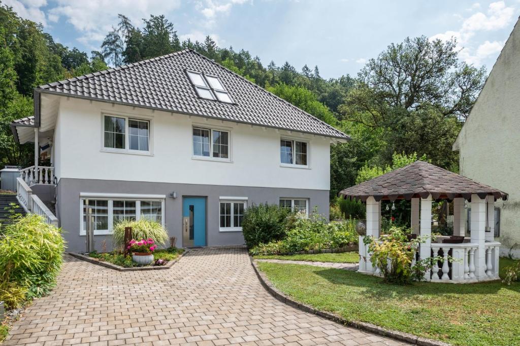 a white house with a gazebo at Ferienwohnung Marina in Stockach