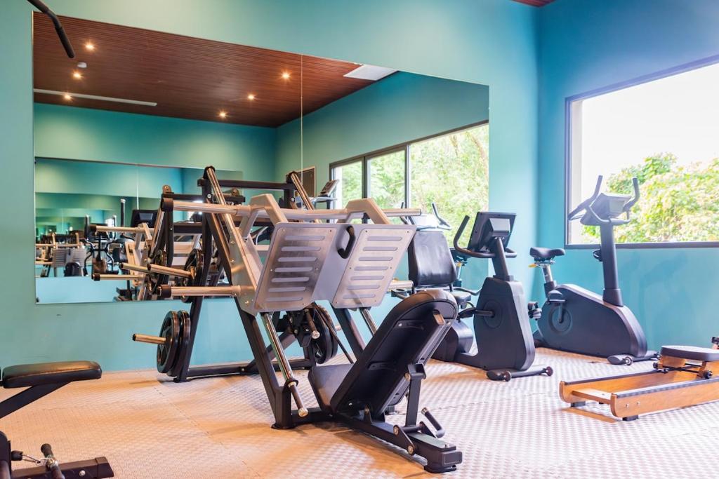 a gym with several exercise bikes in a room at Z Exquisite Koh Samui Domain with Infinity Pool in Nathon Bay