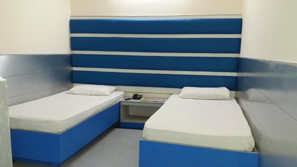 Postel nebo postele na pokoji v ubytování Hotel Kwality