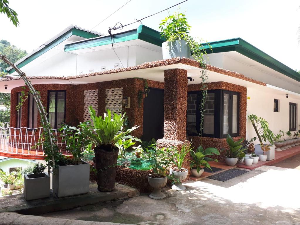 a house with plants in front of it at LUMBINI B&b in Kandy
