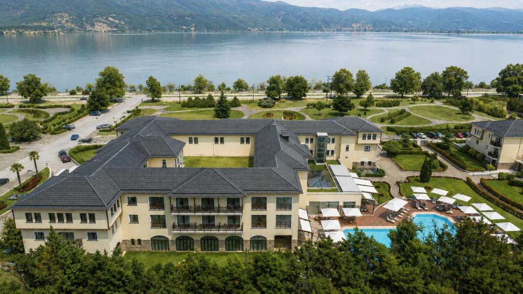 an aerial view of a resort with a lake at Hotel Du Lac Congress Center & Spa in Ioannina