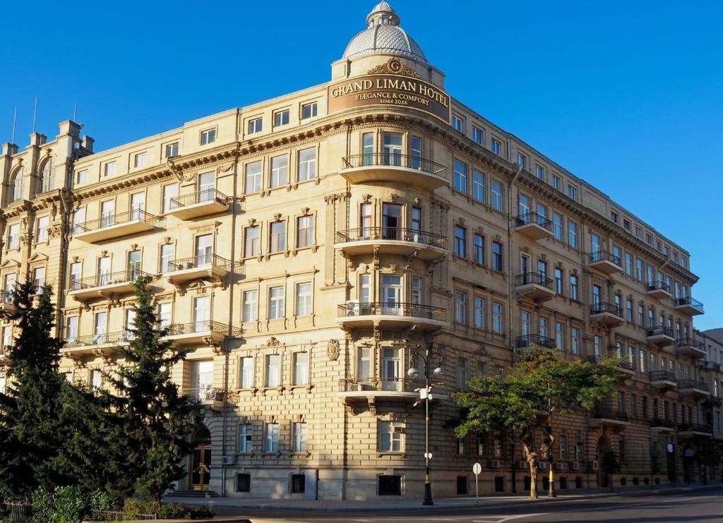 a building with a dome on top of it at Grand Liman Hotel in Baku