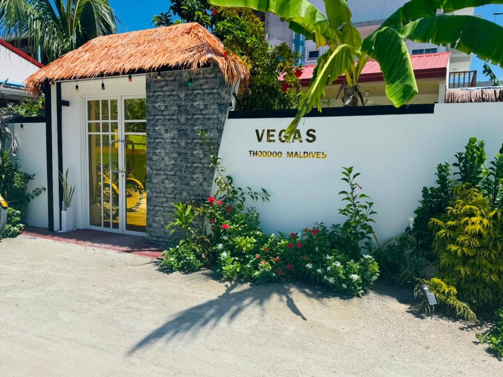a building with a sign that reads vegas tucson market at Vegas Thoddoo Maldives in Thoddoo