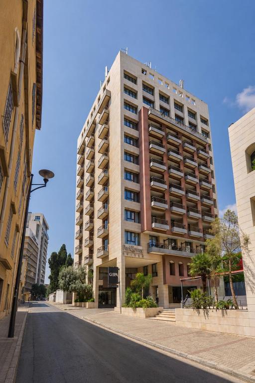 a tall building on the side of a street at ParkTower Suites in Beirut