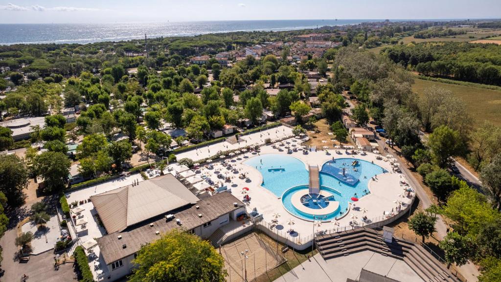 an aerial view of a resort with a swimming pool at Club del Sole Adriano Family Collection in Punta Marina