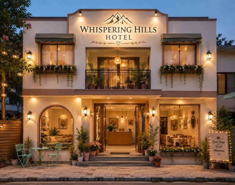 a building with a sign that reads whispering hills hotel at Whispring hills hotel in Sodākor