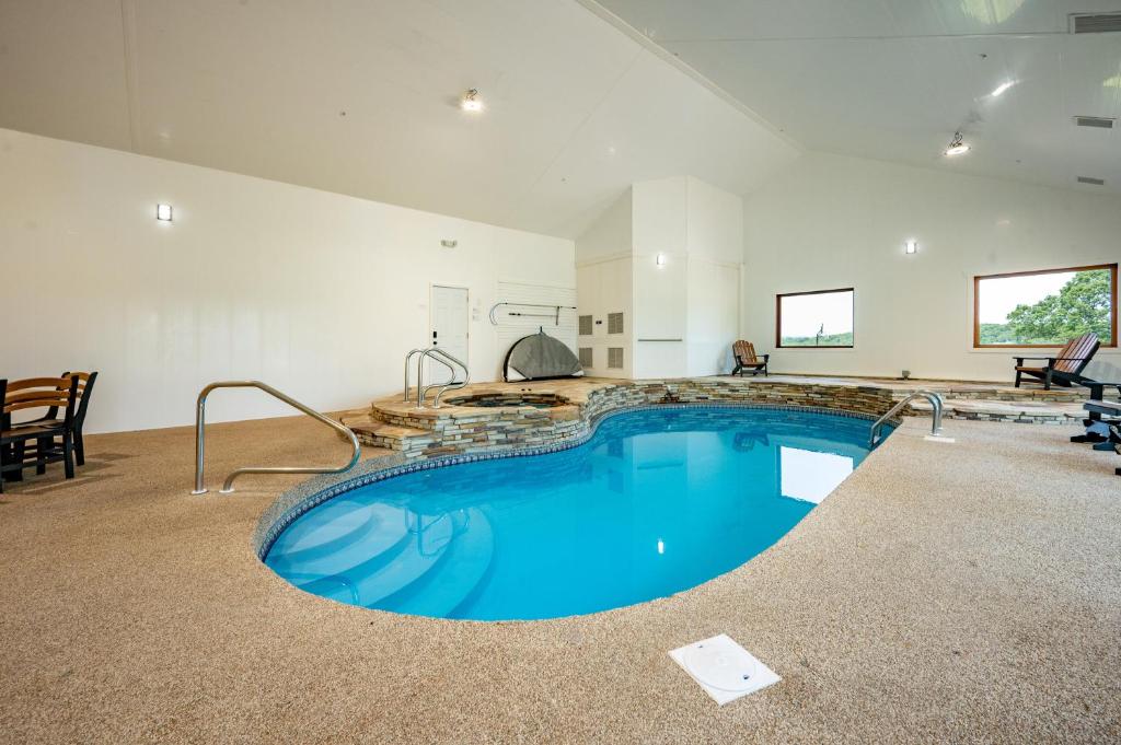 a large swimming pool in a large room at The Herrington by Railey Vacations in Oakland