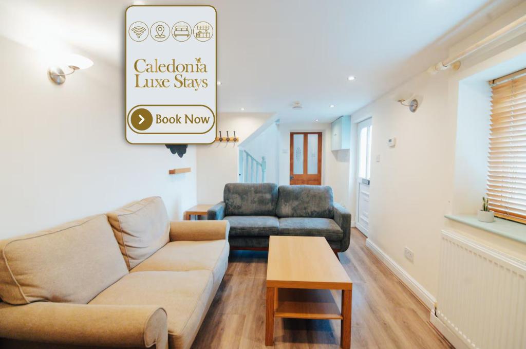 a living room with a couch and a table at The Welsh Welcome in Pen-y-groes