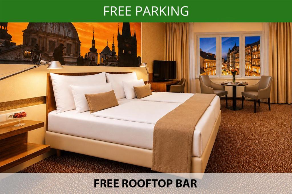 a hotel room with a bed and a free rooftop bar at Metropolitan Old Town Hotel - Czech Leading Hotels in Prague