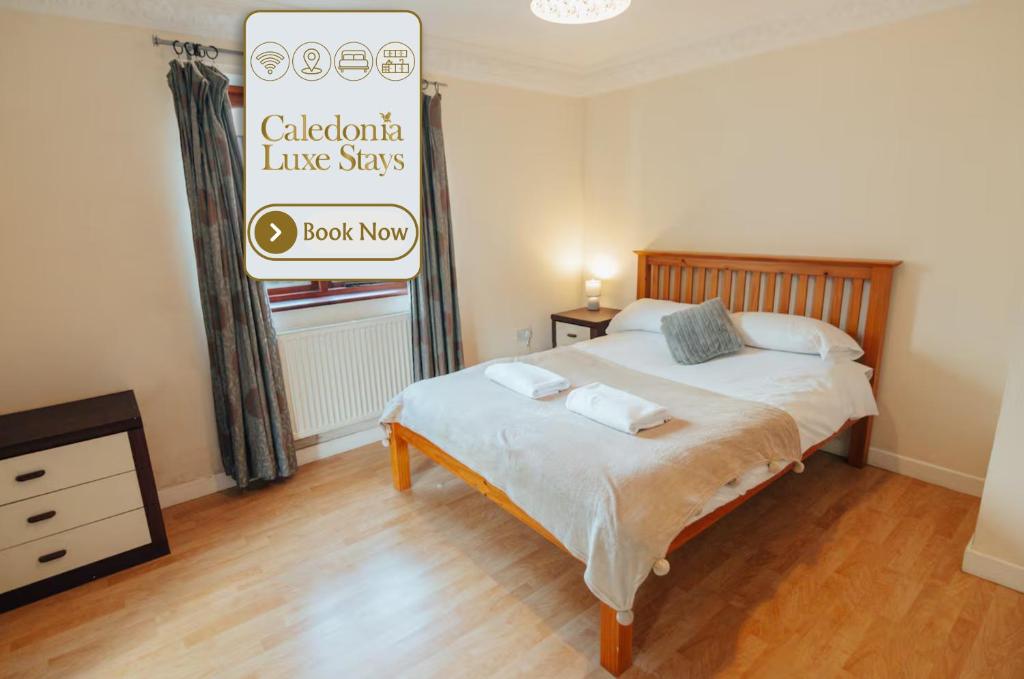 a bedroom with a bed and a sign that reads cabbazon live stars at The Welsh Hideaway in Llanberis