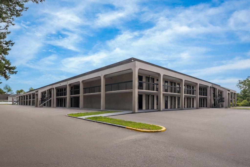 a large building with a lot of windows at Days Inn by Wyndham Norfolk Airport in Norfolk