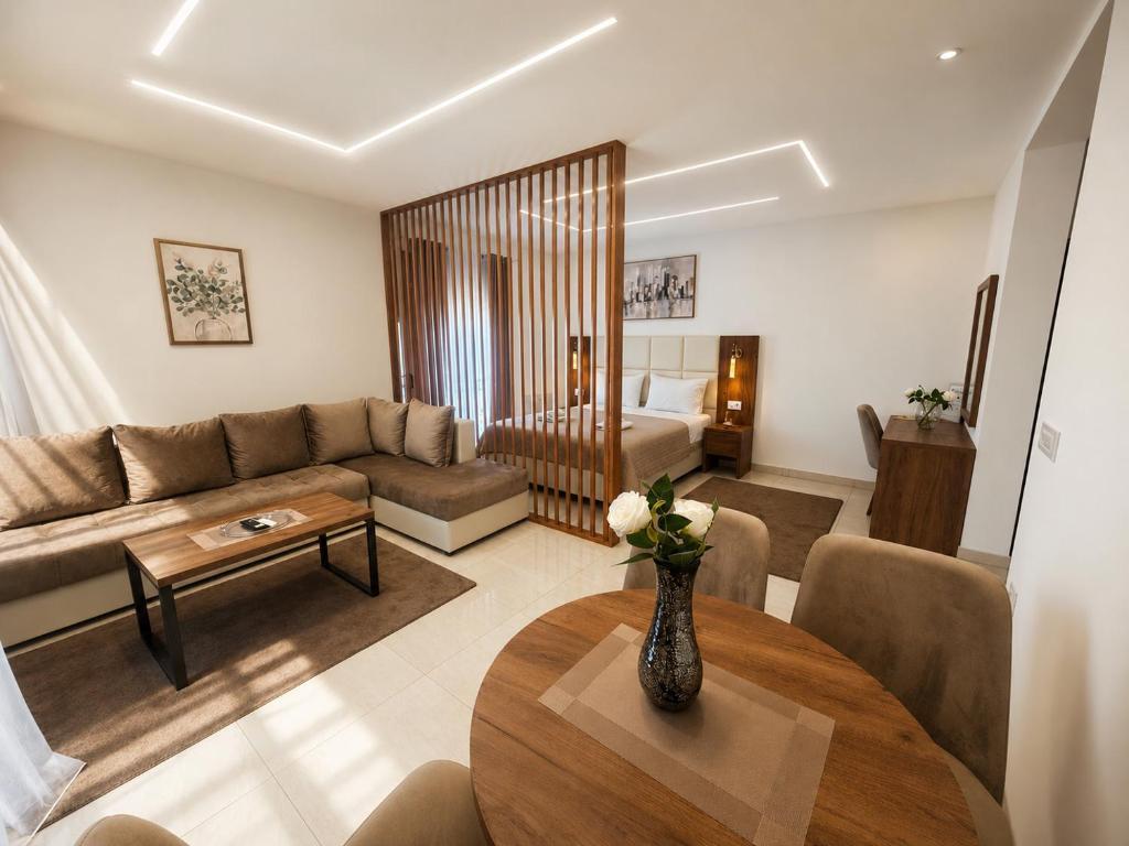 a living room with a couch and a table at Arbneshi Apartments in Ulcinj