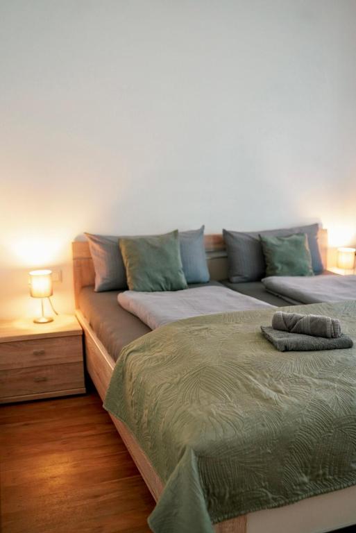 a living room with a couch and a bed at PrimeBnb Am Marktplatz in Bad Hersfeld