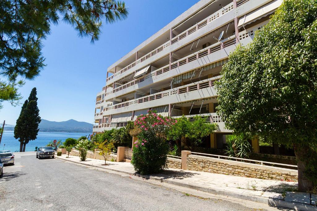 a large apartment building on the side of a street at Amadolia in Loutra Edipsou